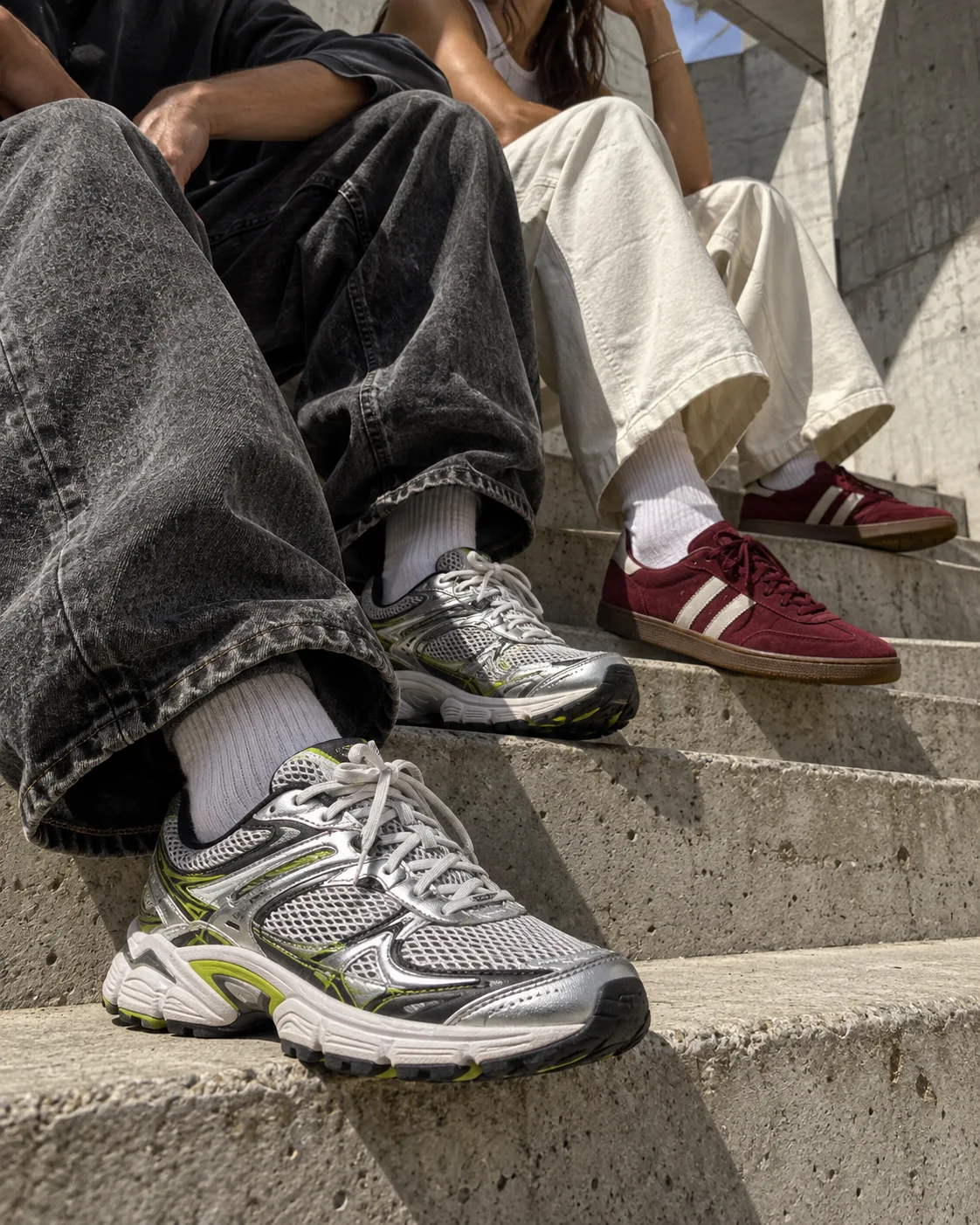 Streetwear styling with relaxed denim and retro running shoes